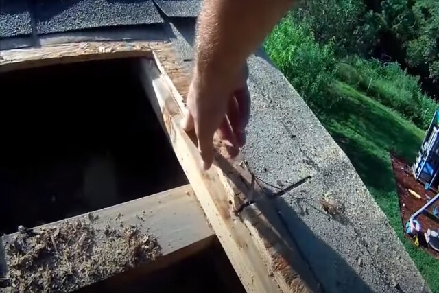 Worker showing leaking roof area